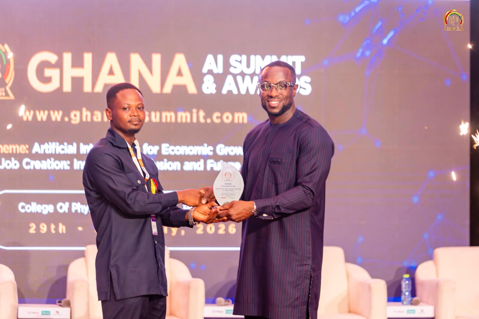 Stephen Totimeh receiving the AI Personality of the Year award on stage