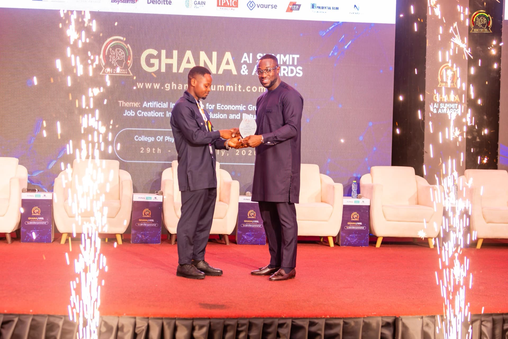 Award presentation moment with celebratory sparklers at the Ghana AI Summit
